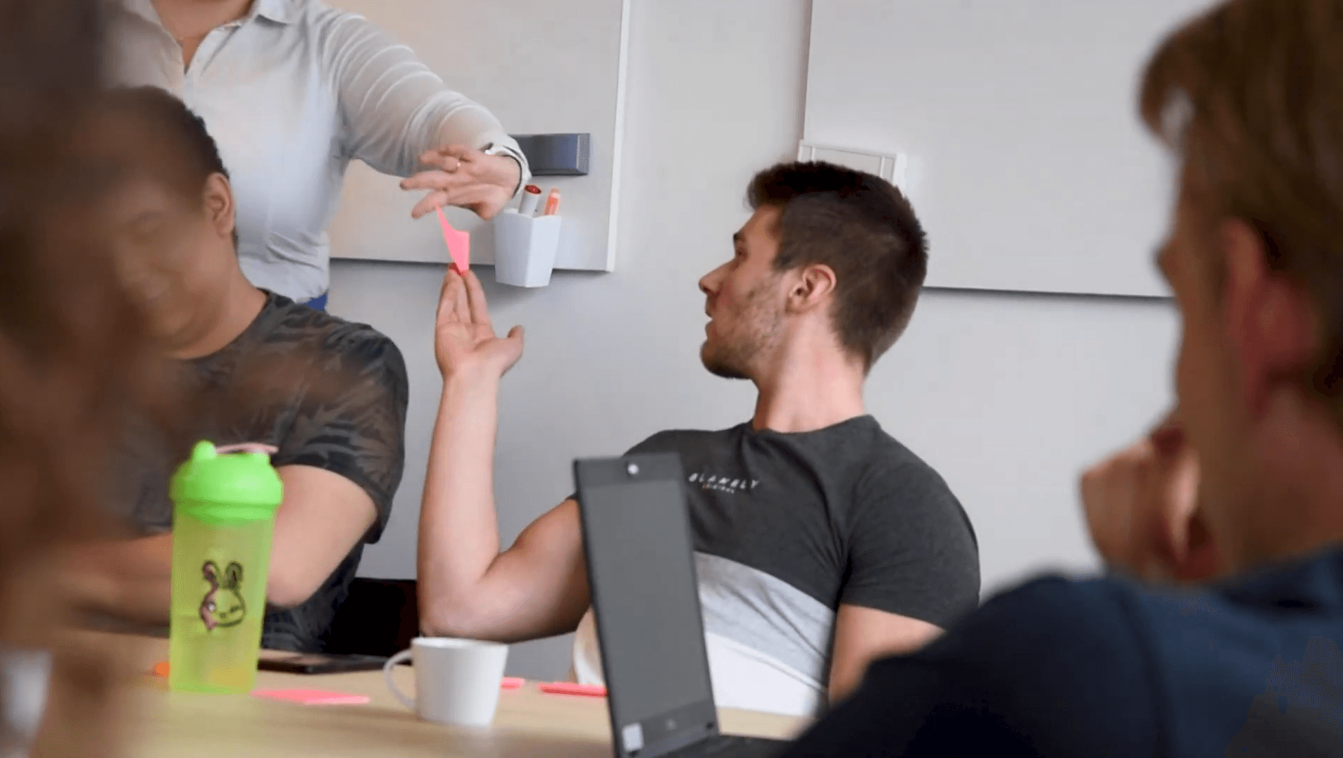 Innovative workplace with diverse team collaborating; key aspects of careers at Keylane, fostering growth, teamwork, and professional development in the insurance and pension industry.