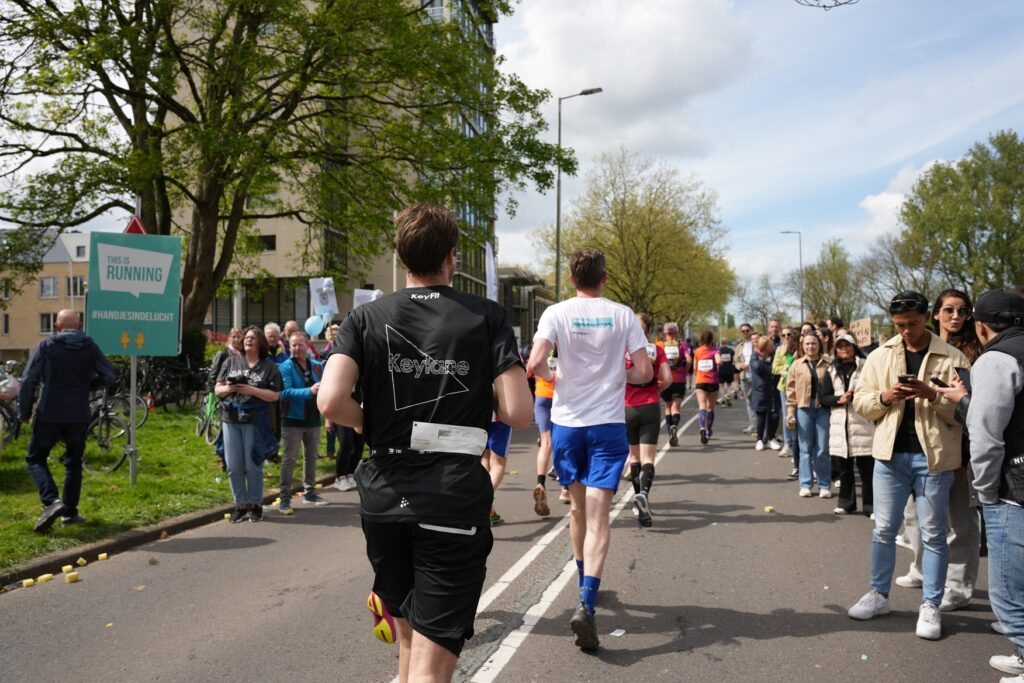 Keylane team members cheering on marathon participants