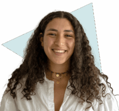 Bright smiling woman with curly hair representing Keylane Careers and job opportunities in insurance and financial technology sectors.