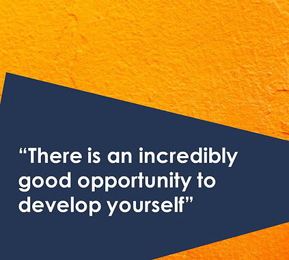 Motivated professional smiling in business attire at Keylane Careers, emphasizing growth opportunities in the tech and insurance industries.