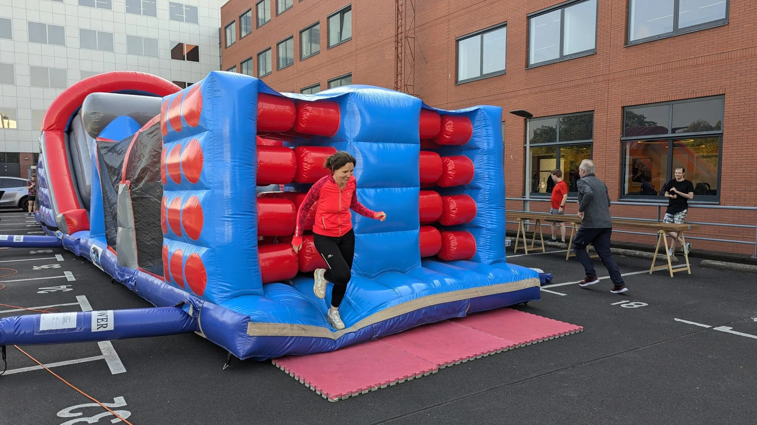 Jumping into fun at Keylane Careers inflatable bounce house for team building and employee engagement during corporate event.