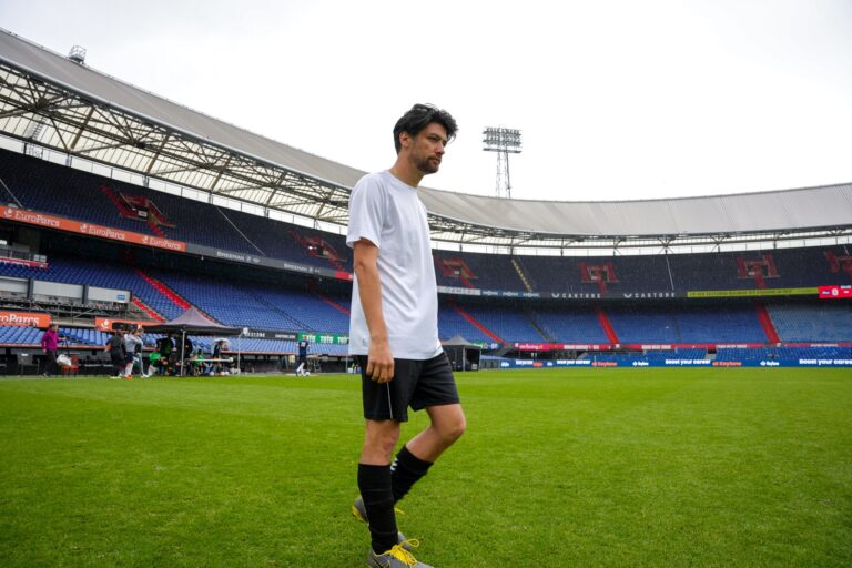 Keylane colleagues walking onto the pitch at De Kuip, Feyenoord Stadium, for the corporate football tournament on 4 June 2024