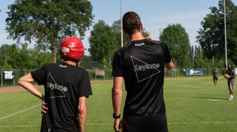 Two colleagues waiting to bat during Keylane's annual softball tournament in Zwijndrecht